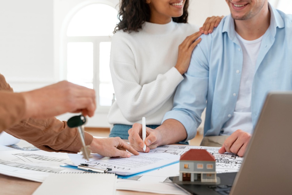 Couple Signing Contract For Real Estate Property